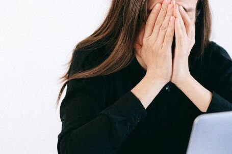 Emotional Resilience - Stressed Woman Covering her Face with her Hands