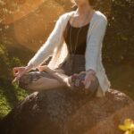 Meditation - Woman Meditating on Rock