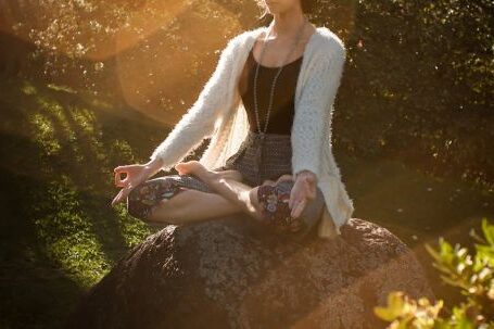 Meditation - Woman Meditating on Rock