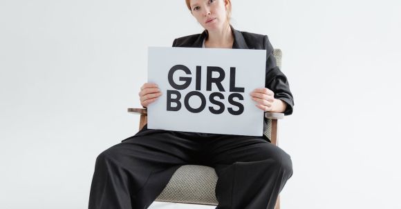 Personal Empowerment. - Woman in Black Blazer and Pants Holding a Girl Boss Postcard